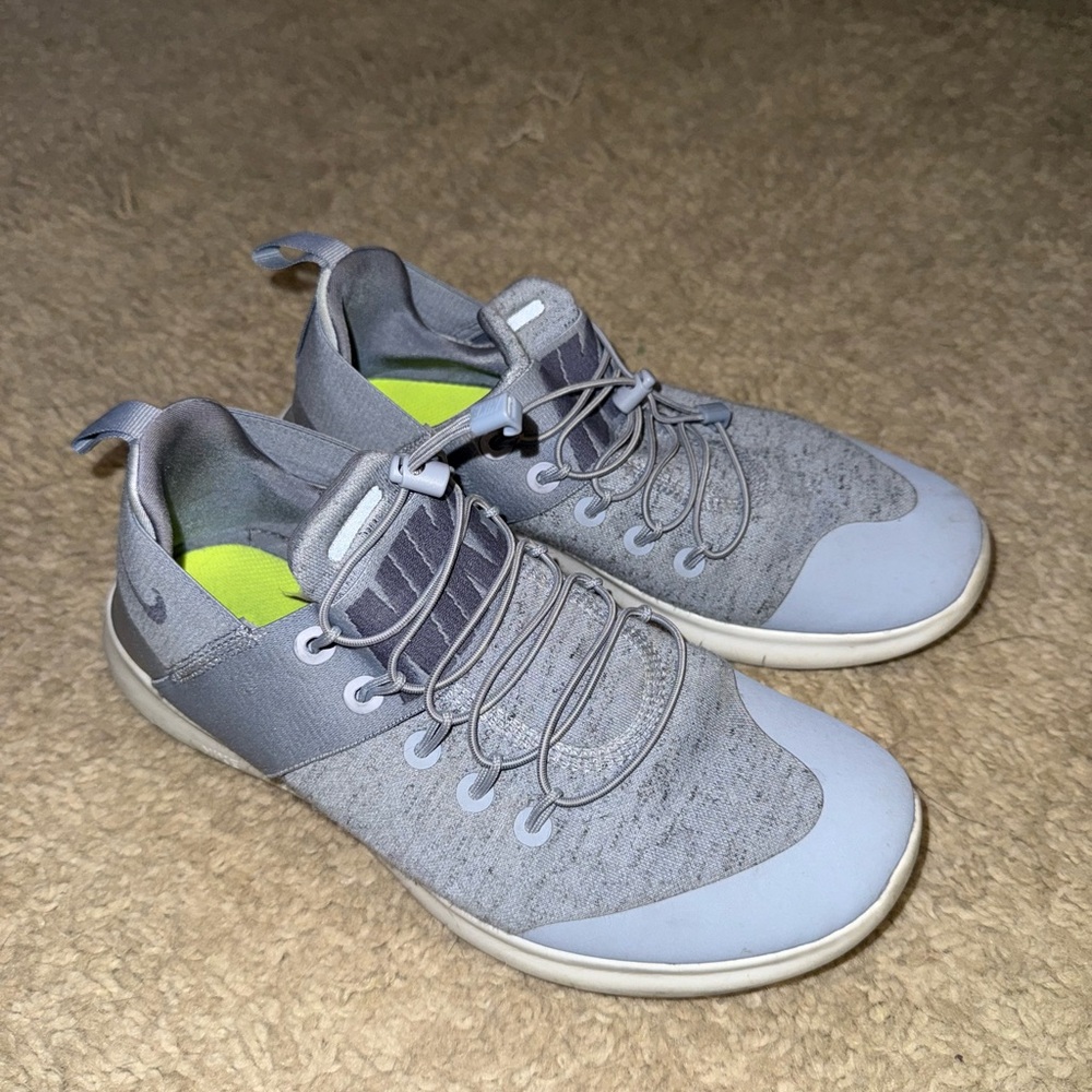 Nike Gray Sneakers with Unique Lacing System and Lightweight Design